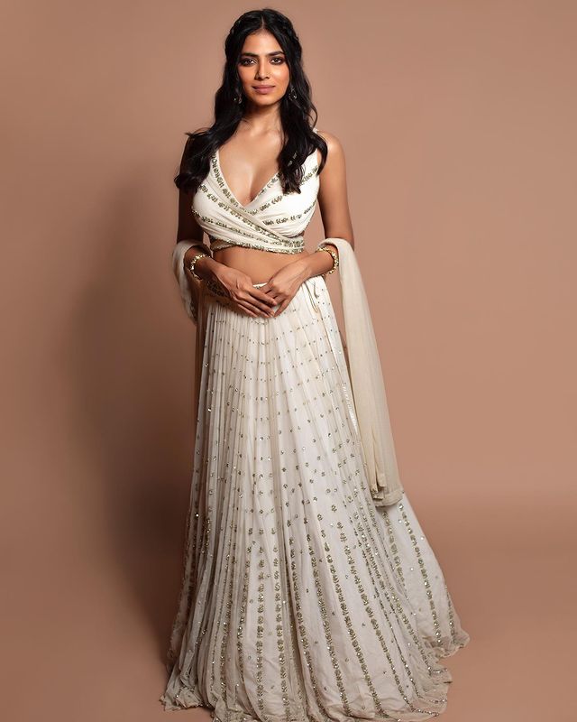 Graceful off-white sequence with zari embroidered georgette lehenga