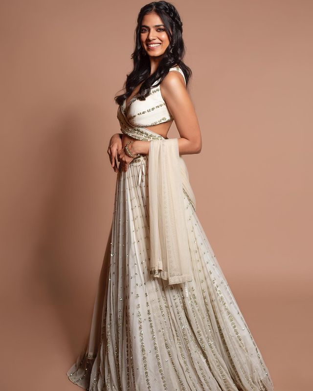 Graceful off-white sequence with zari embroidered georgette lehenga