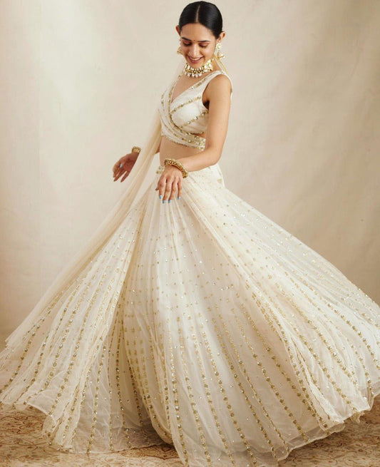 Graceful off-white sequence with zari embroidered georgette lehenga