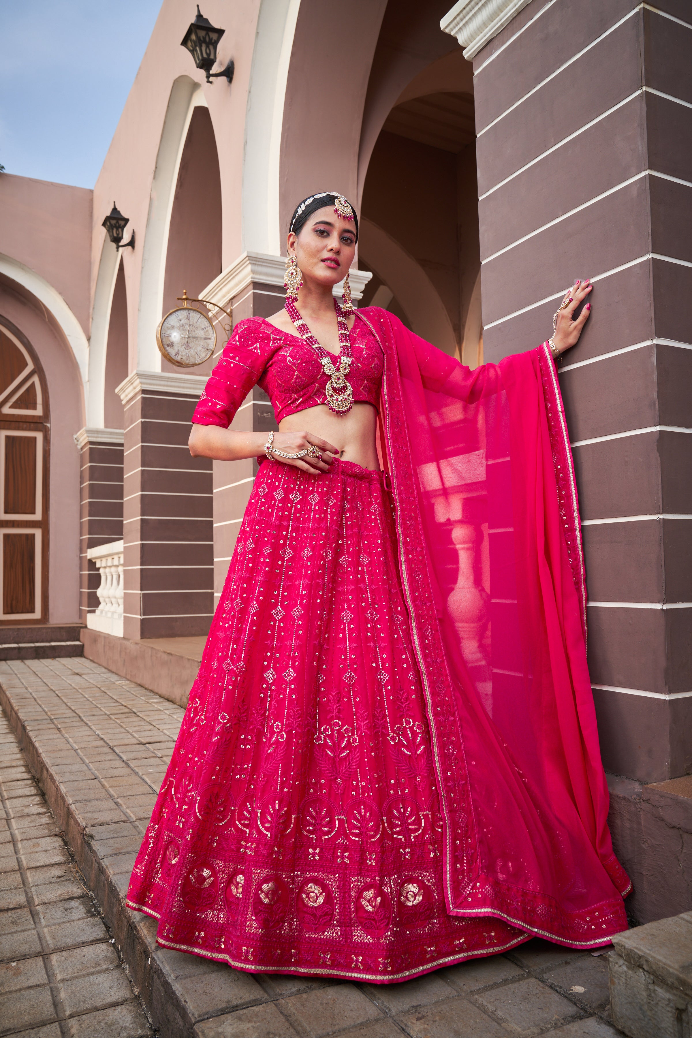 Photo of Bride and groom in fuschia pink coordinated outfits | Indian  wedding outfits, Indian bridal outfits, Groom outfit